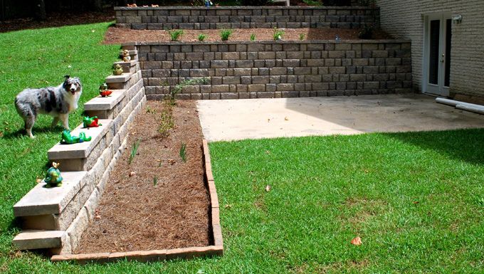 Terraced retaining wall and centipede sod