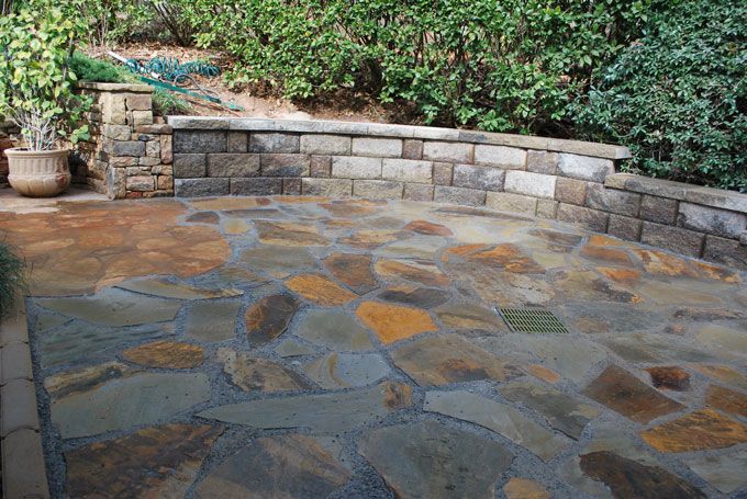 flagstone patio with a seat wall