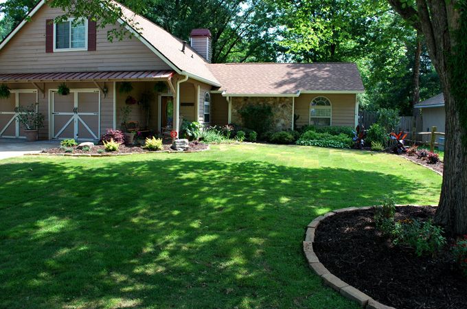 Lawn with fresh sod and rock boarder.