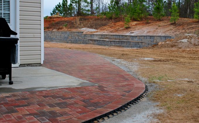 Holland stone patio added to a concrete deck to enlarge outdoor living space