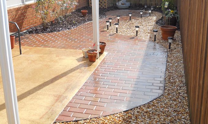 no maintenance courtyard with brick paver and french drainage