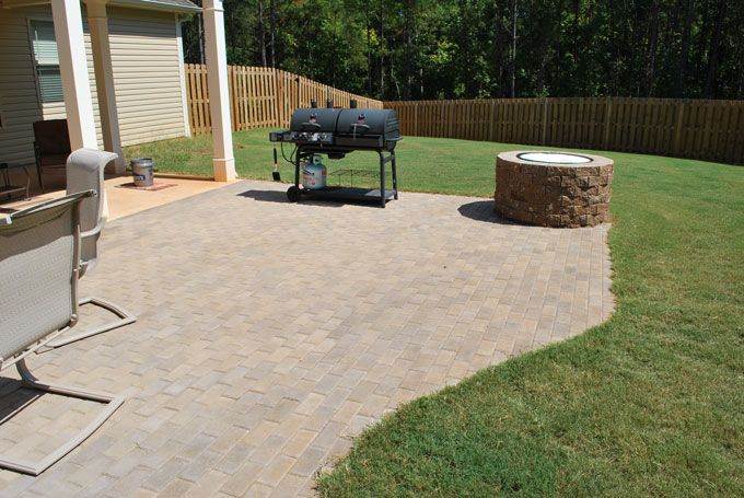 paver patio with a fire pit and garden furniture