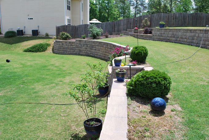 retaining walls supporting a downhill lawn