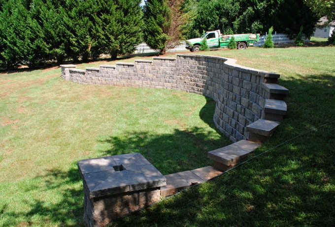 long curved stepped retaining wall with column end