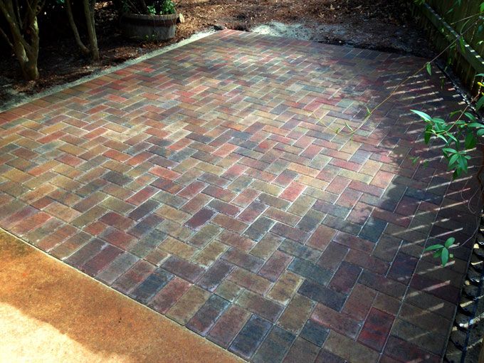 Holland stone patio installed next to a concrete deck