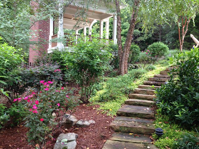 slab stone steps on a slope of a garden