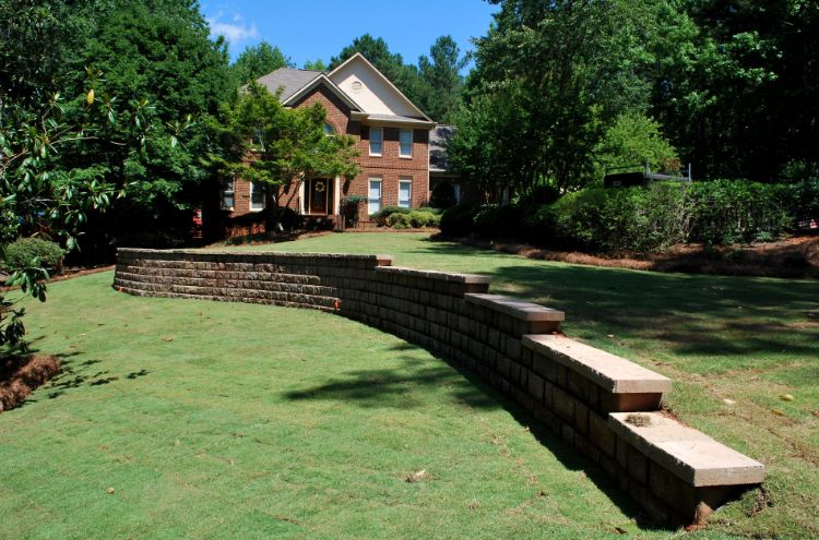 stepped wall supporting large downhill lawn