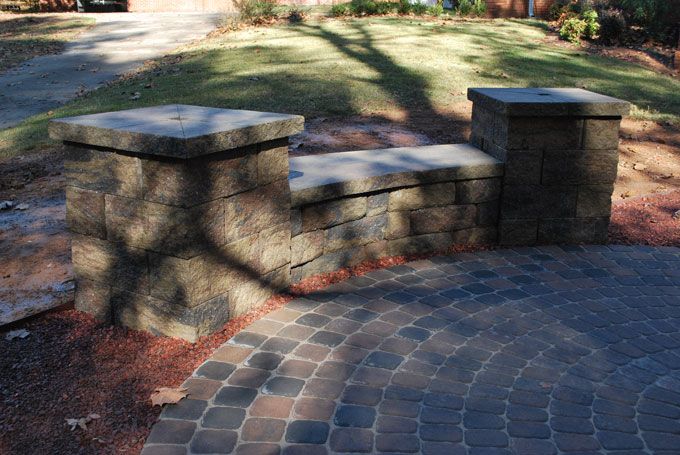 circle kit pavers with knee wall bench with columns at the ends