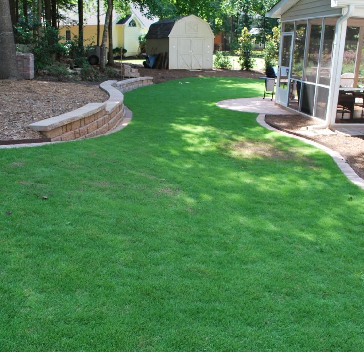 Pavers Installed along the base of the retaining wall to save time on lawn string trimming.