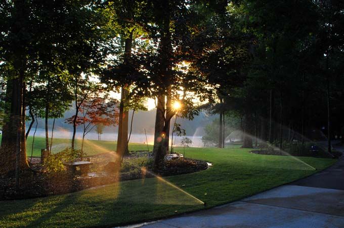 working sprinklers using water being pump from a lake