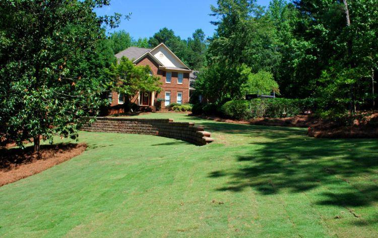 Large downhill lawn with new sod.