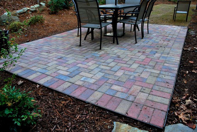 old town blend stone paver patio with a table and chairs