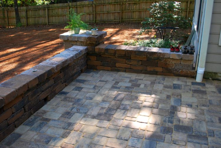 Patio the finished look colorful browns and tans with overhanging caps on columns and knee wall