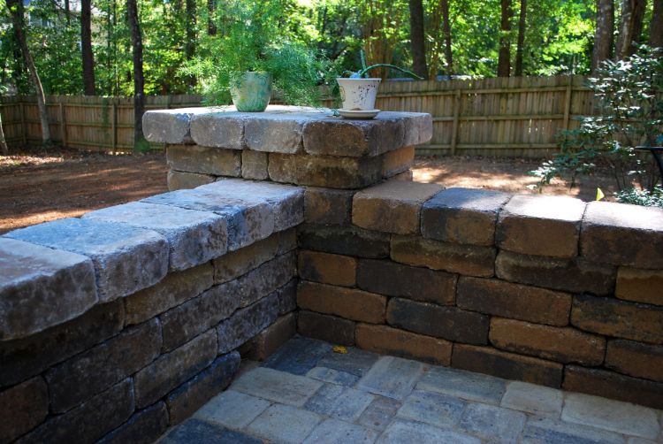 patio with knee wall with columns on the corners