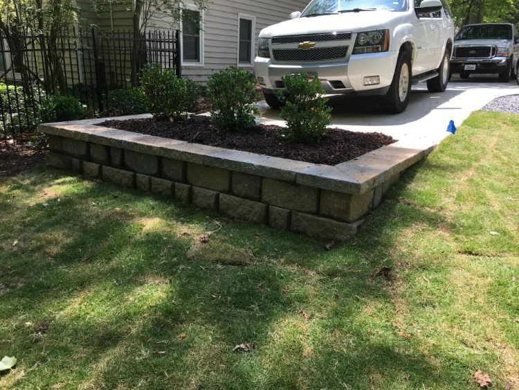 small wall for raised herb garden