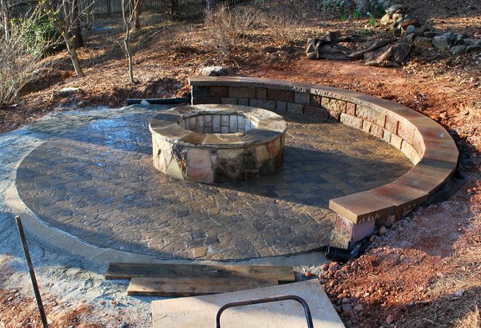 natural stone pave patio with sitting wall and fire pit
