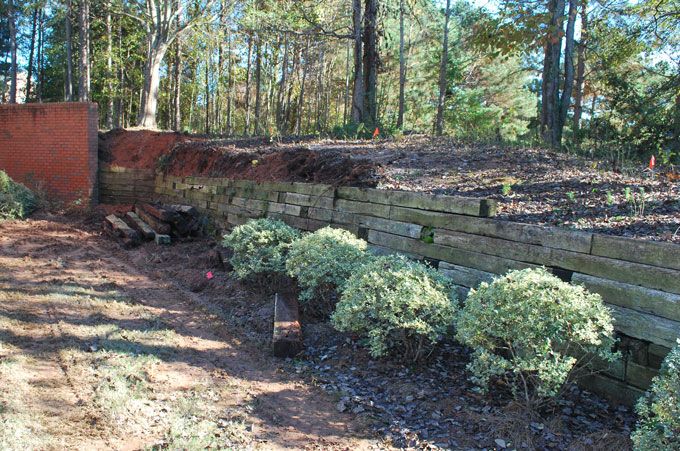 taking down old failing wooden wall