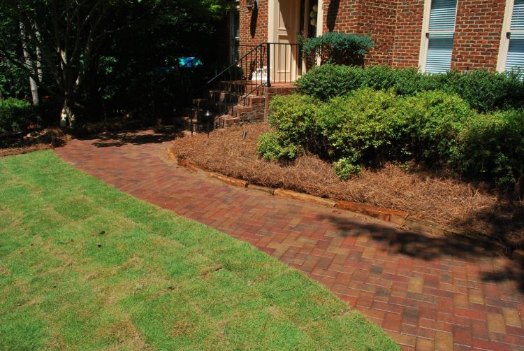 sealed paver walkway matching the color of house stone