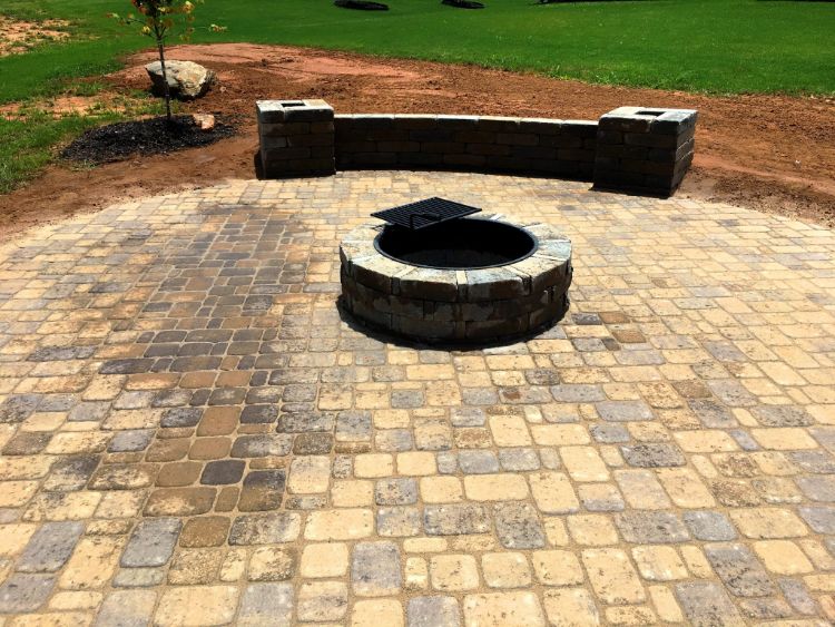 simple bench with columns on paver patio with fire pit kit