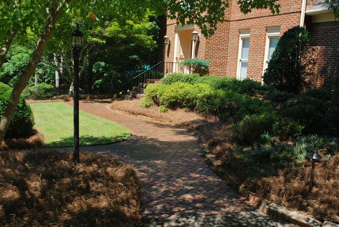 colorful concrete pavers side walk in front of a house