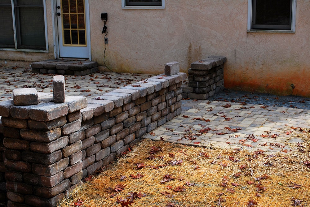 a grill pad adjacent to the patio