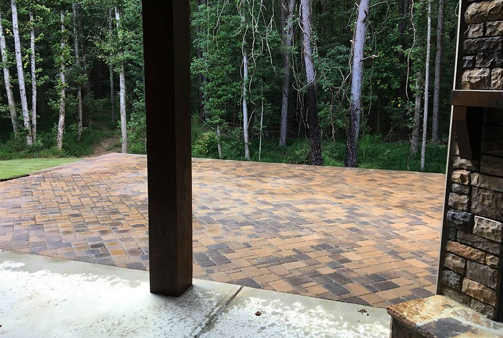 pave stone patio with a beautiful view of forest