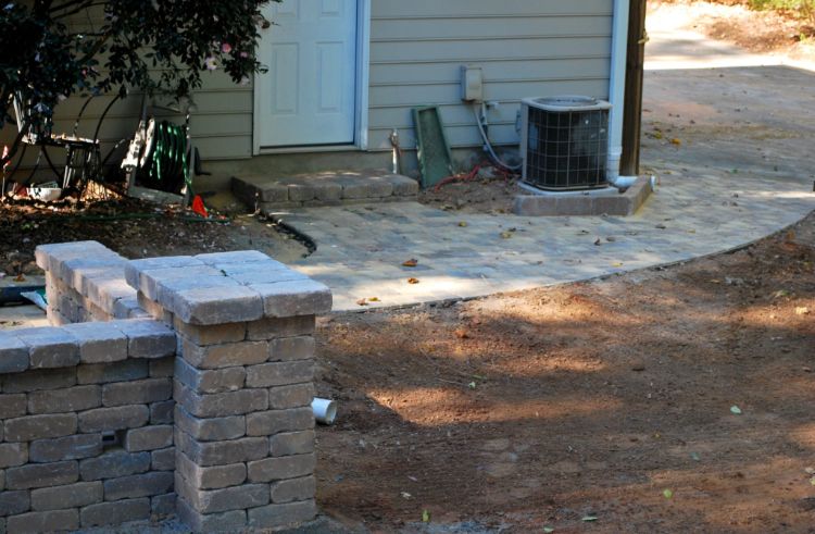 extending the patio pavers to create a walk way to the gate