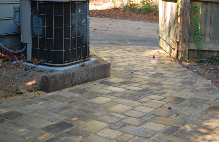 use wall blocks to hold back the dirt under the A/C